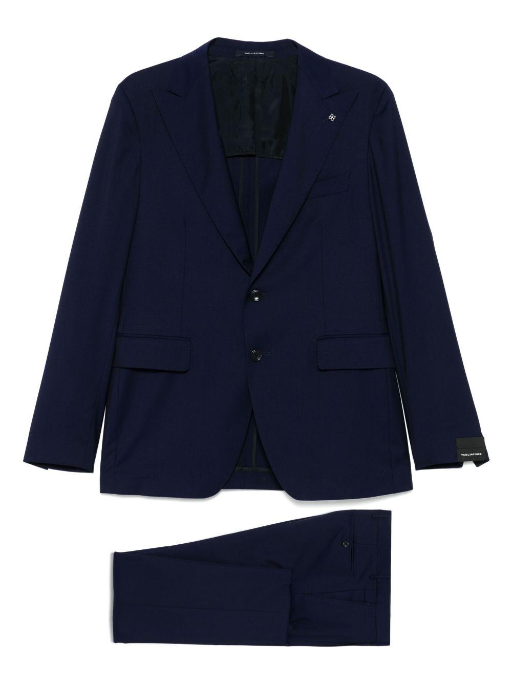 Abito blu navy con spilla 