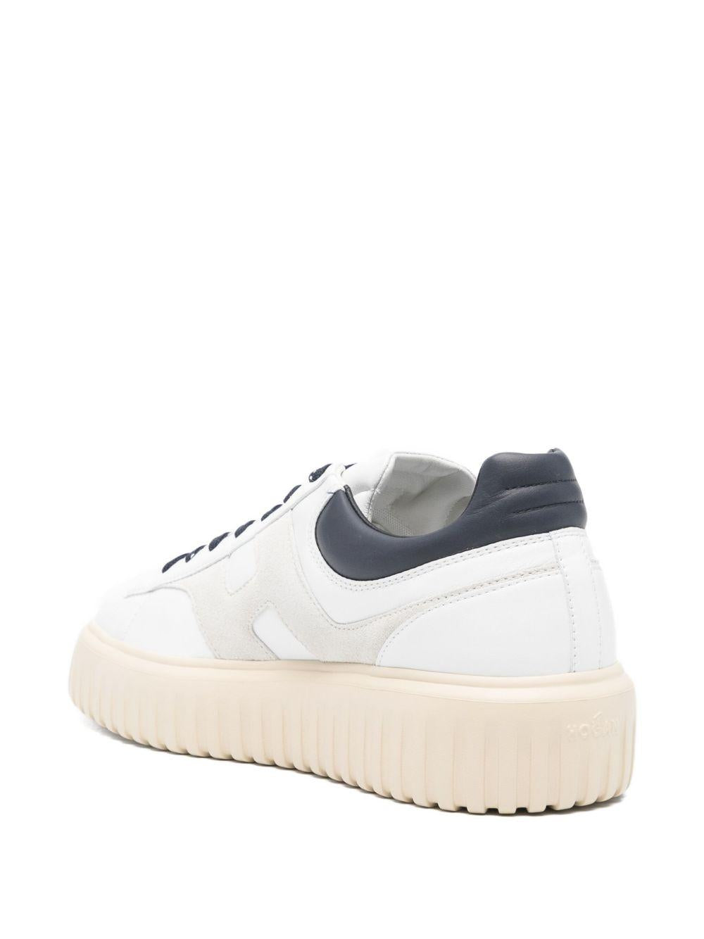 Sneakers bianche in pelle con suola rialzata 