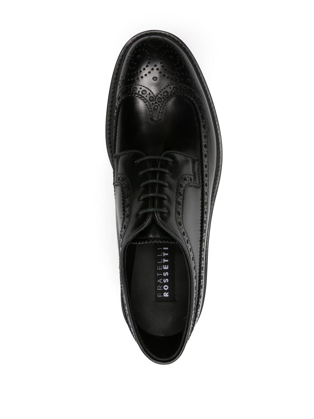 Brogues nere con inserti 