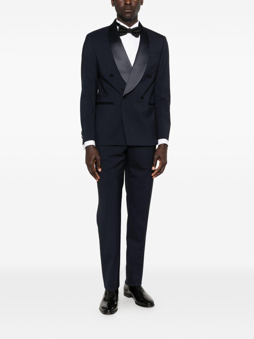 Smoking blu navy doppiopetto con rever sciallato 
