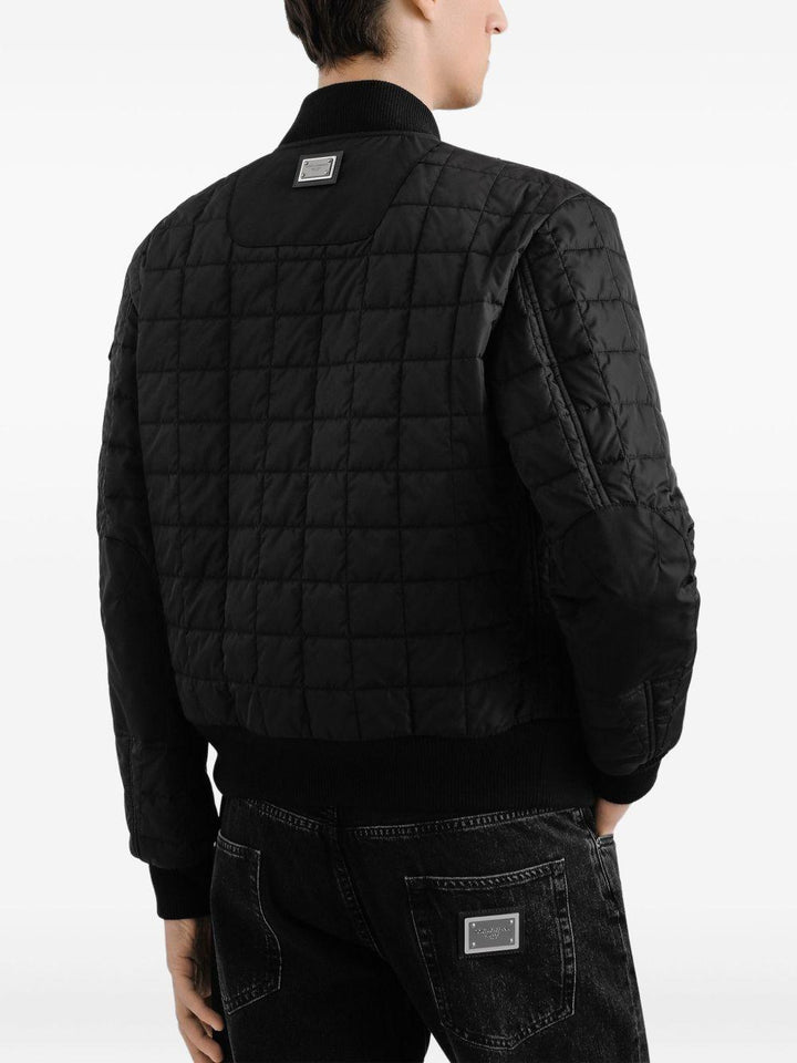 Bomber trapuntato nero con zip e tasche ad aletta 
