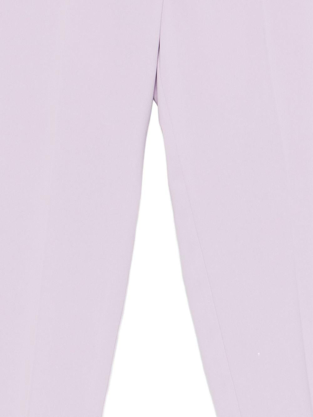 Pantaloni con bottoni 