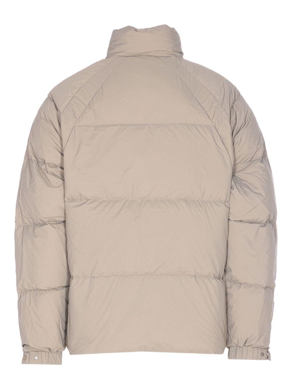 Piumino con collo a imbuto beige 