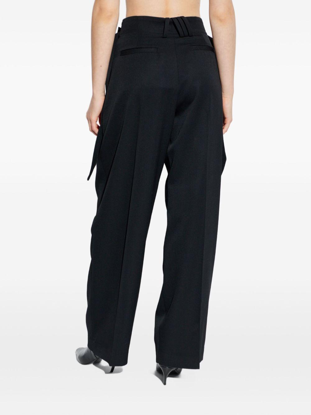Pantaloni con fibbie 