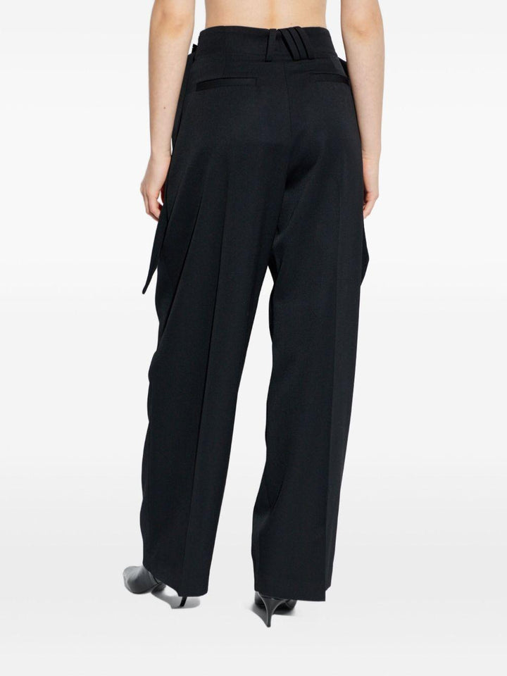 Pantaloni con fibbie 