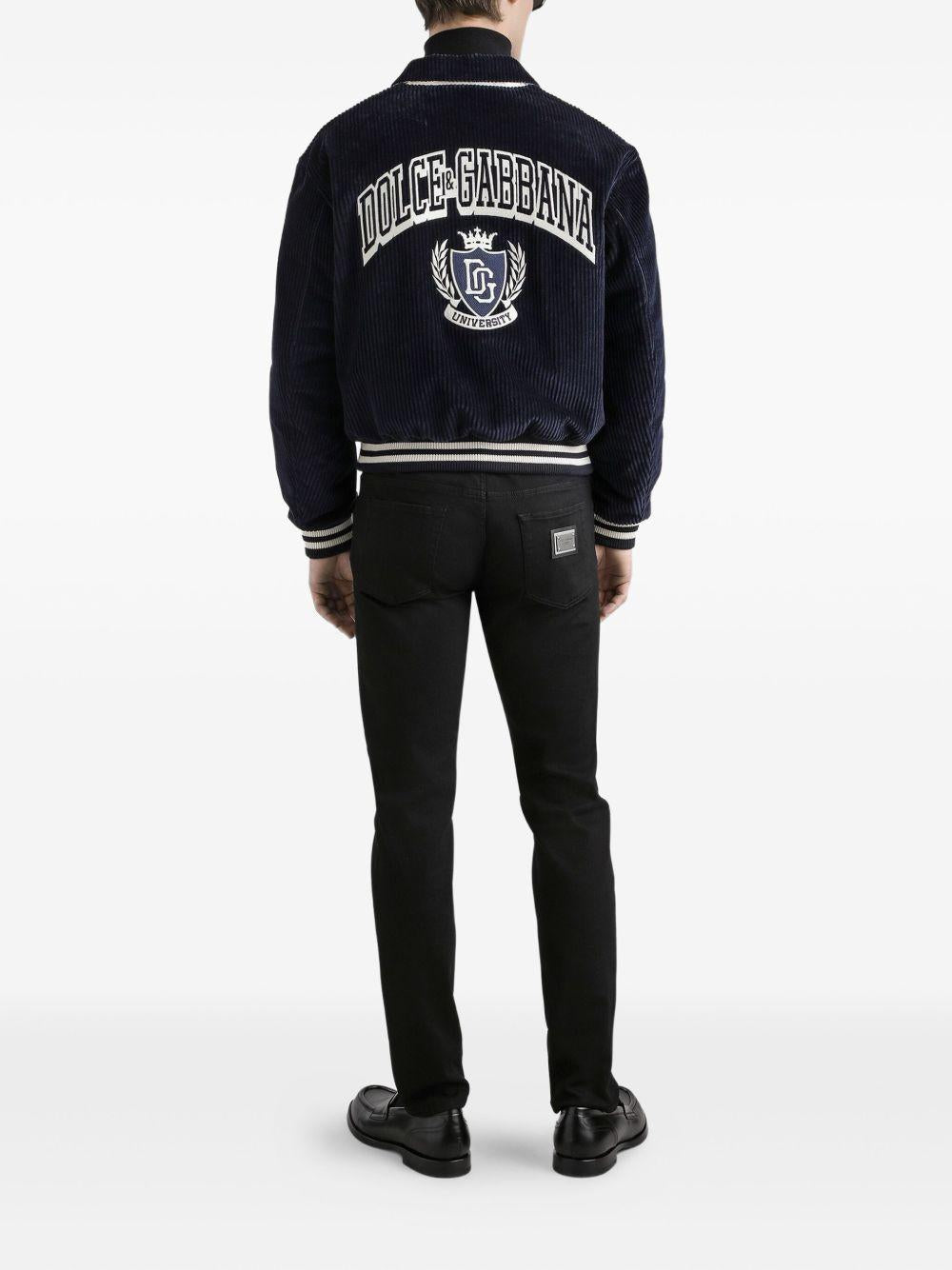 Jeans neri in cotone con placca logo 