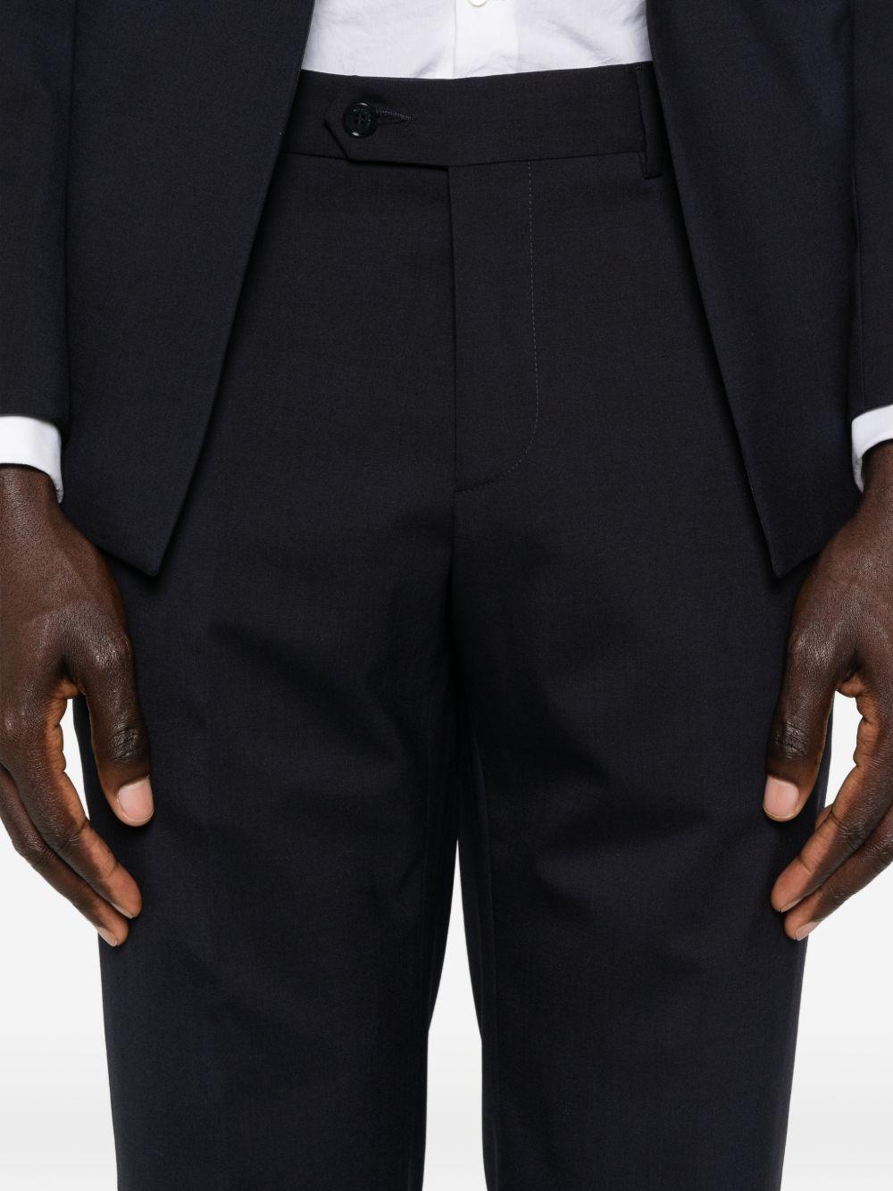 Smoking blu navy doppiopetto con rever sciallato 