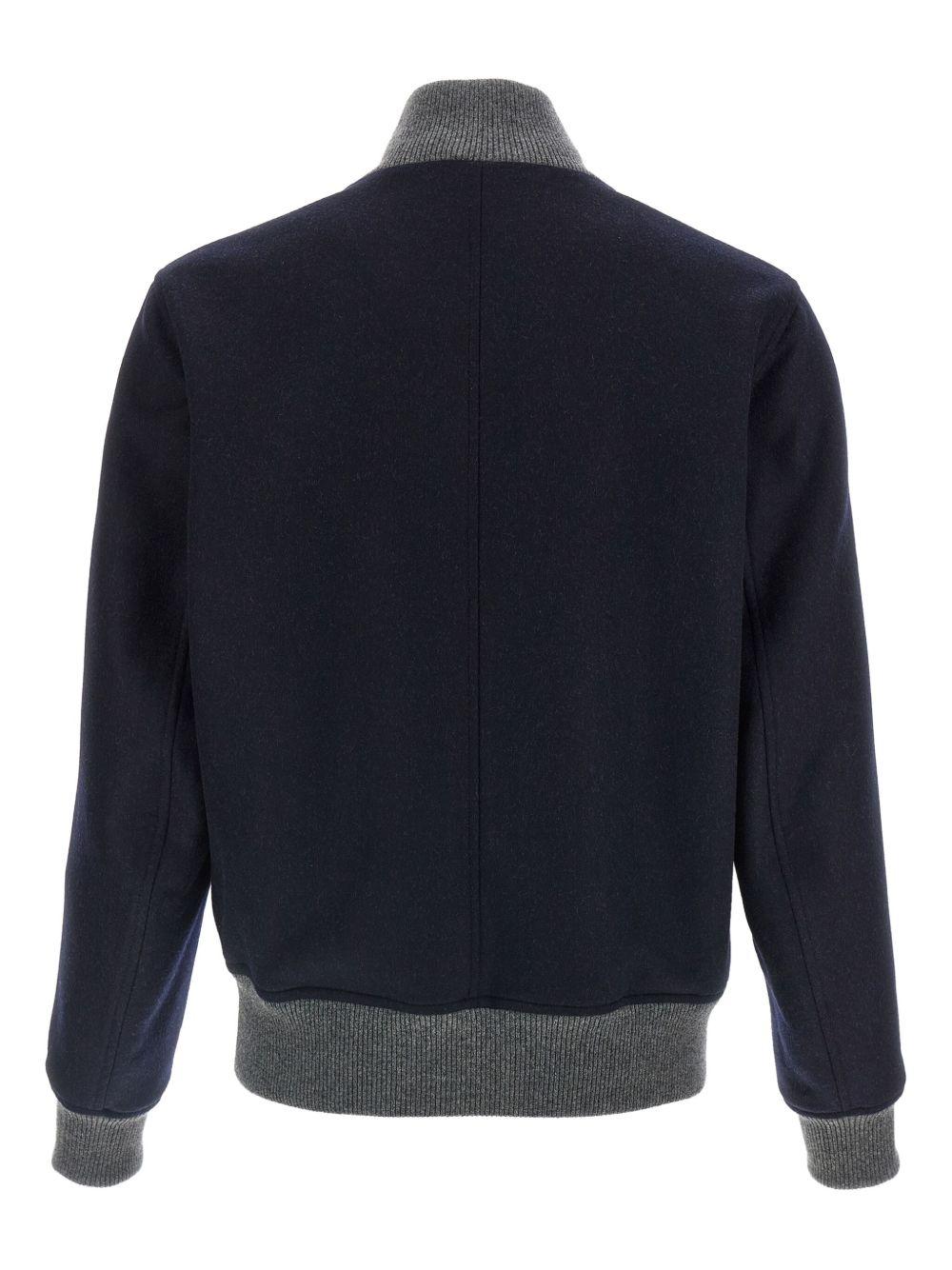 Bomber navy con bottoni e tasche con patta 