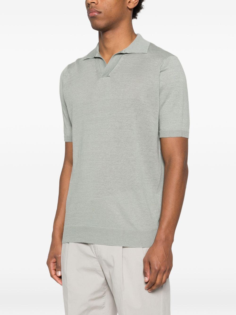 Polo verde con scollo a V 