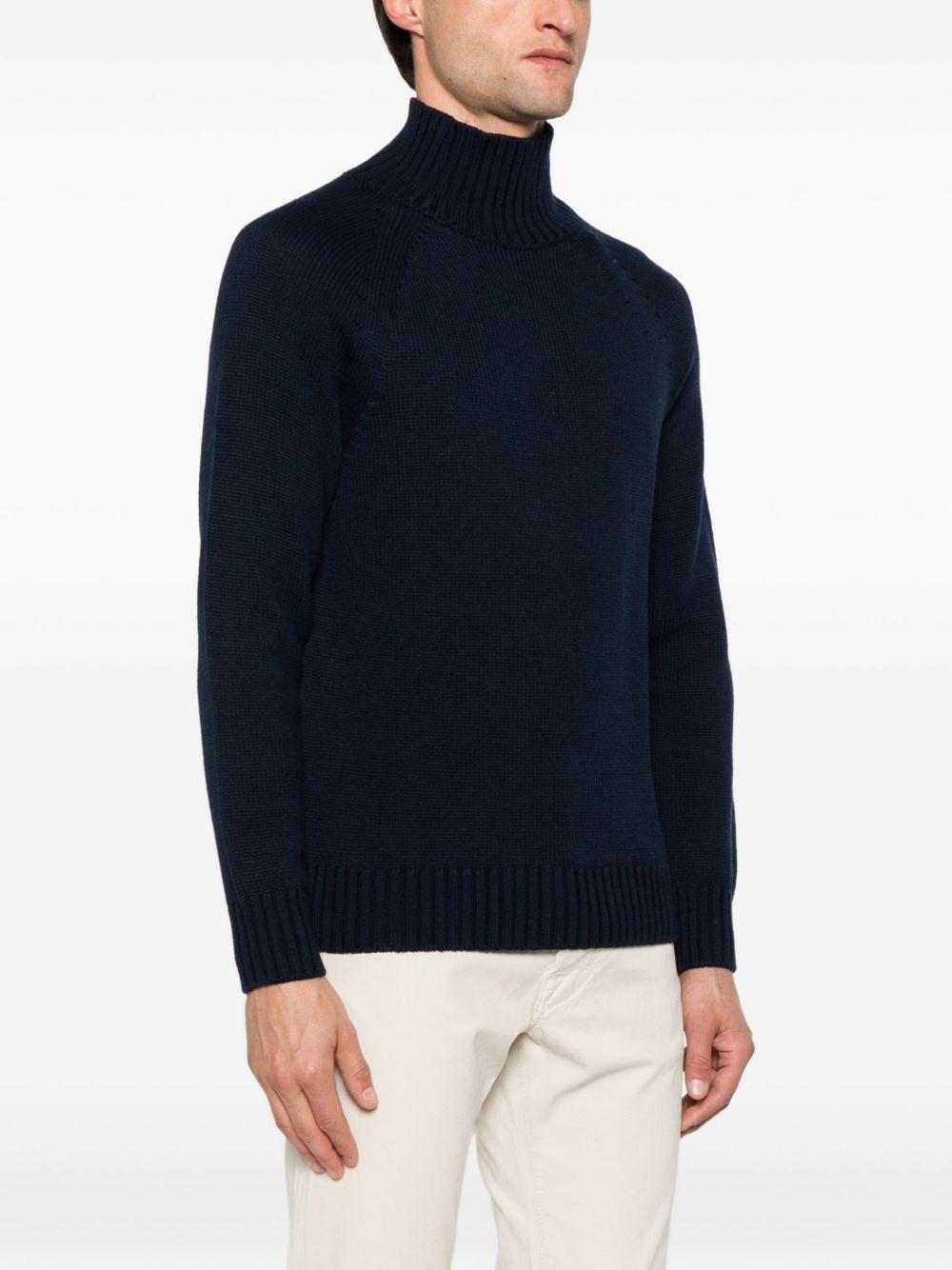 Maglione nero in lana a collo alto 