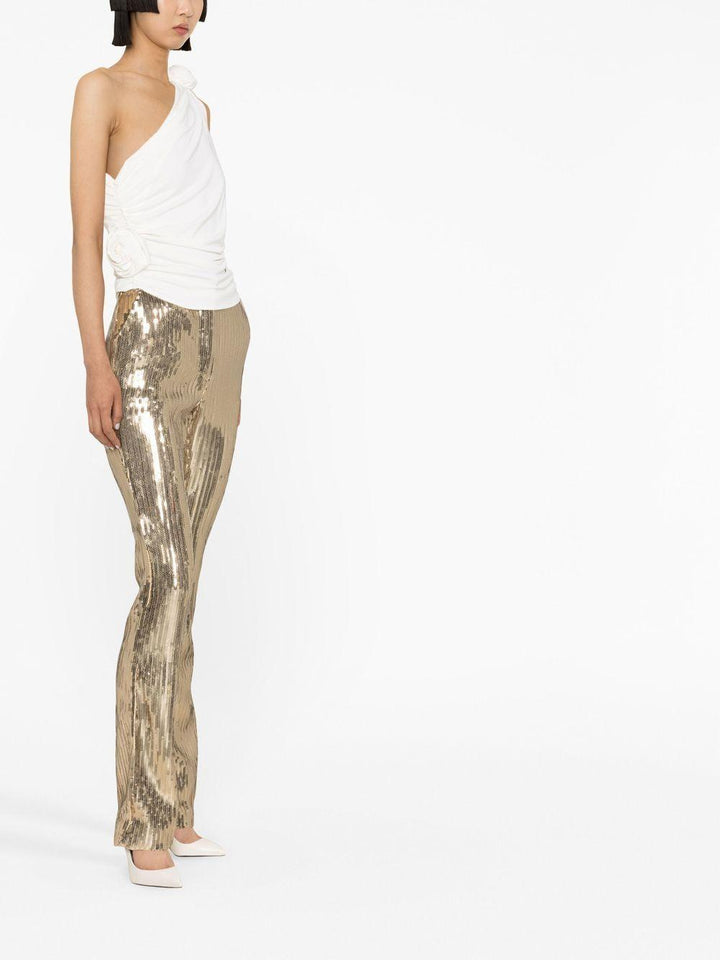 Top monospalla con fiore 