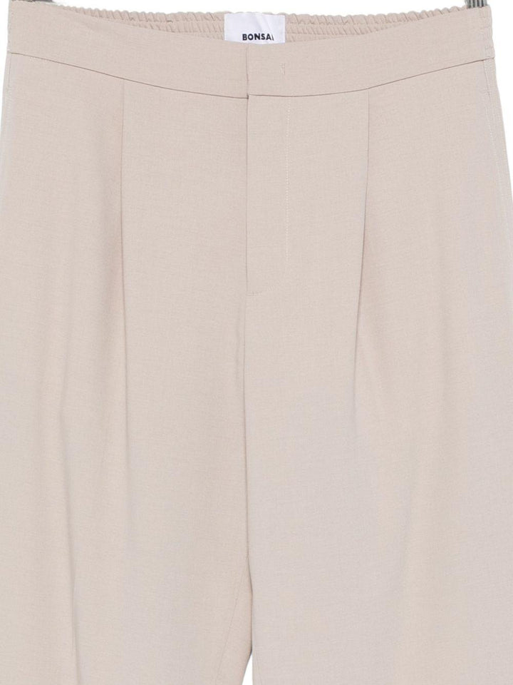 Pantaloni con piega beige 