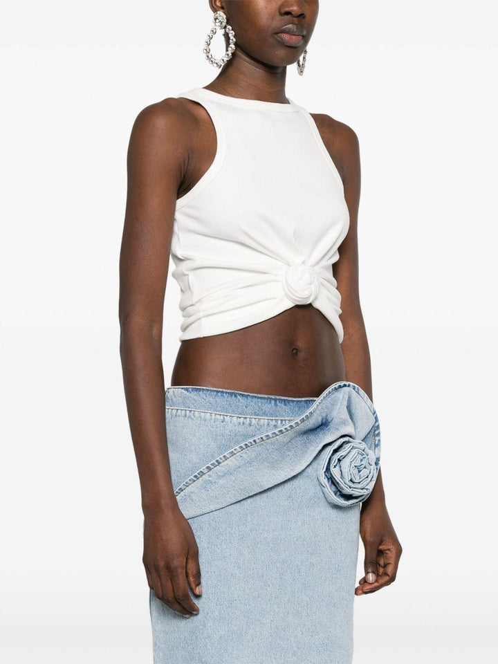Top con fiore 