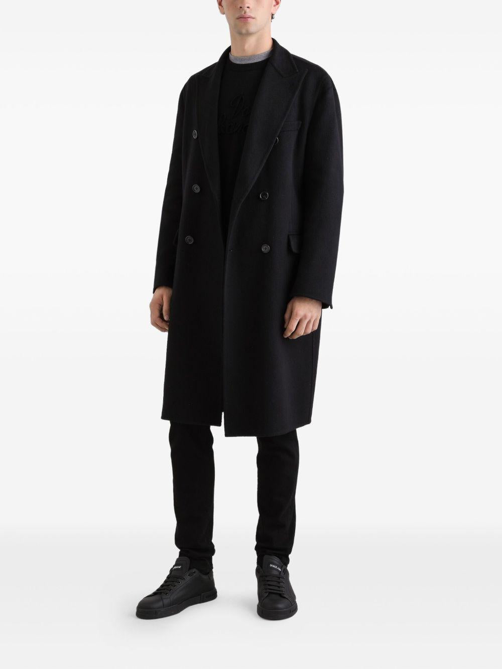 Maglione nero girocollo con logo ricamato 