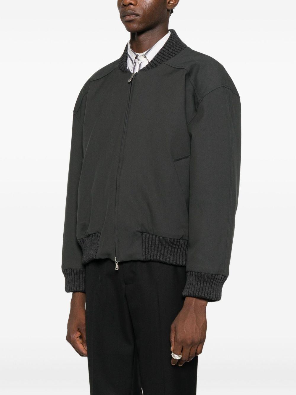 Bomber grigio con zip 