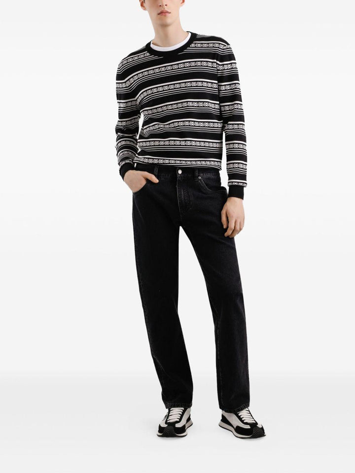 Jeans neri in cotone con applicazione logo