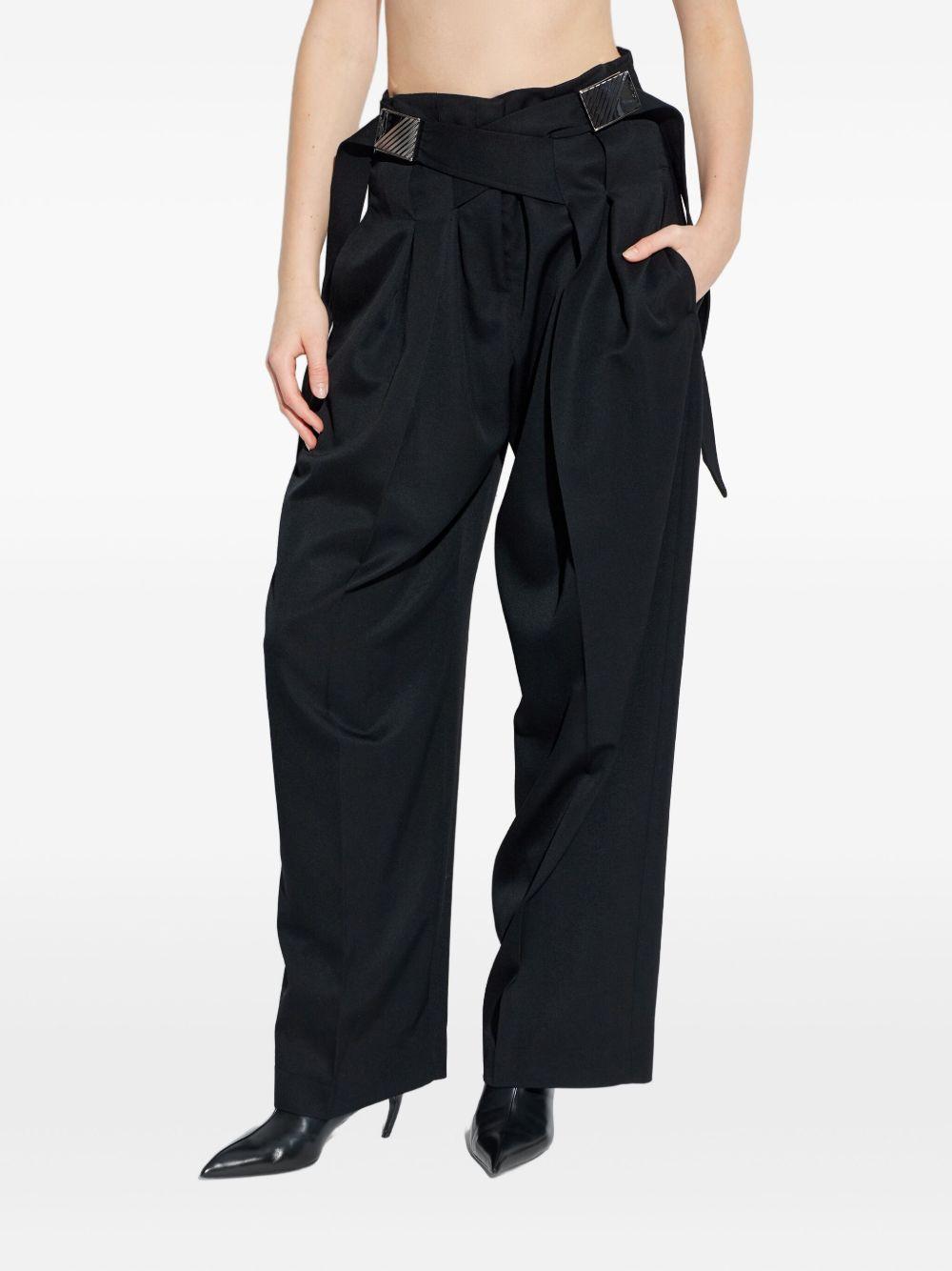 Pantaloni con fibbie 