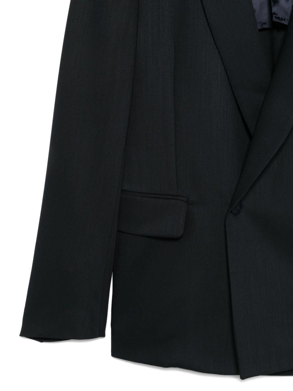 Giacca blu con revers a scialle 