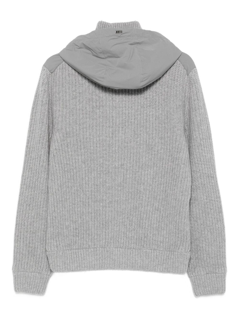 Giacca grigia a coste con cappuccio e zip 