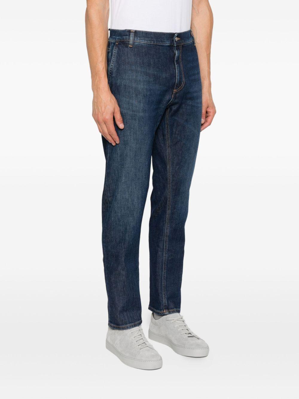 Jeans blu in cotone con cinque tasche e lavaggio scuro 