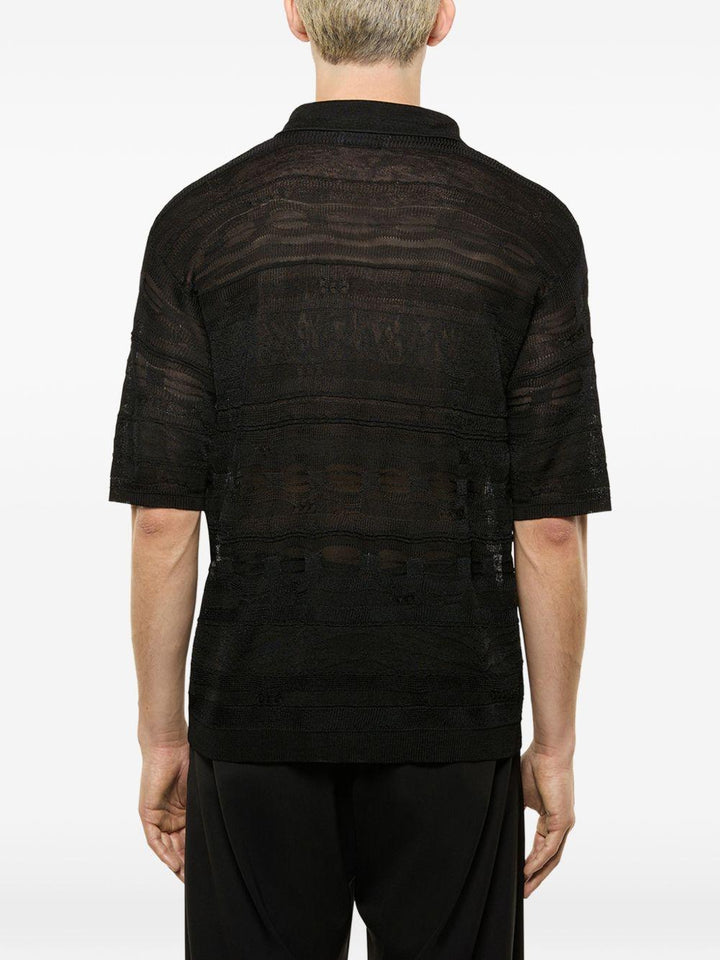 Polo nera in maglia semi trasparente 
