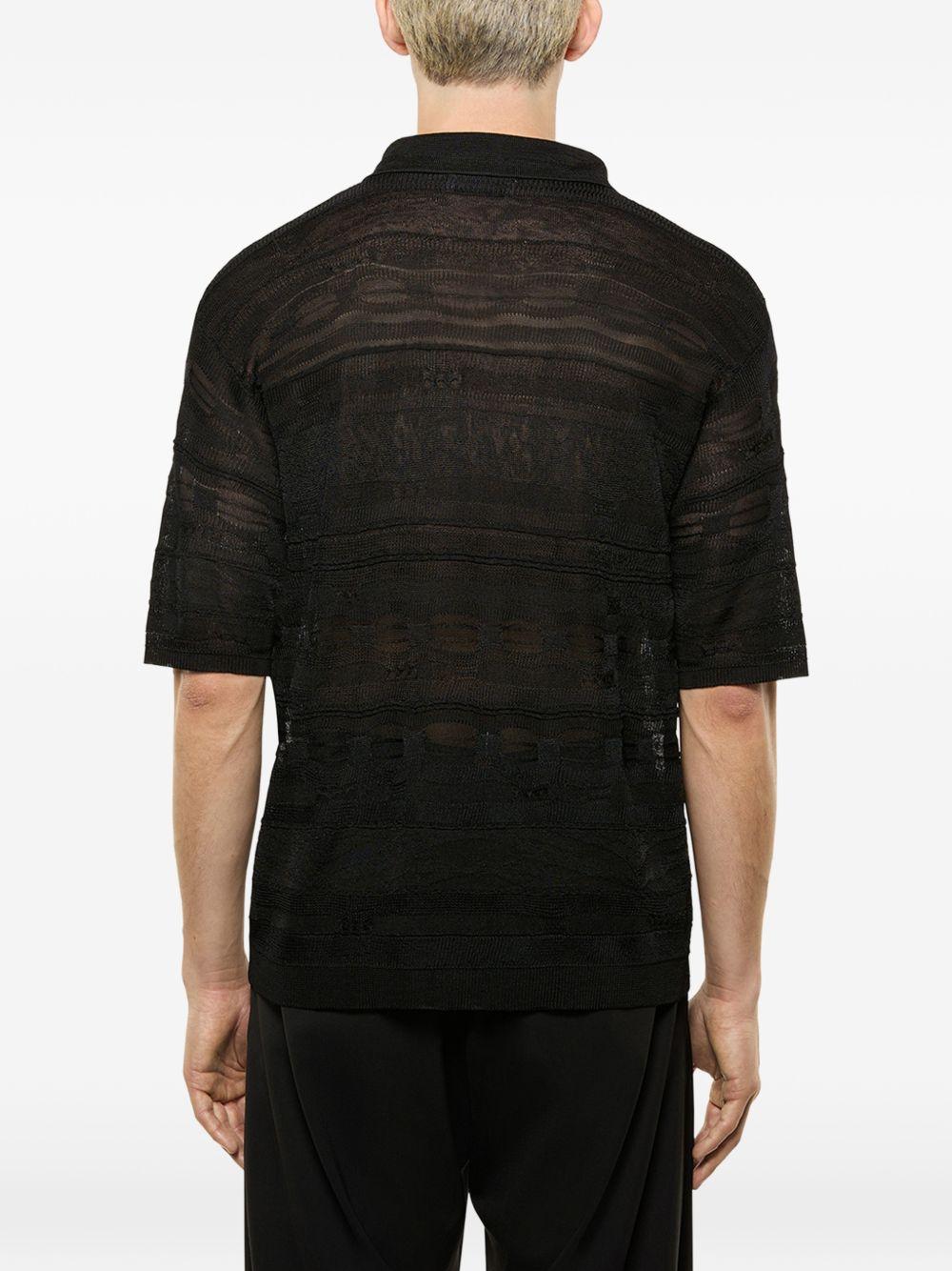Polo nera in maglia semi trasparente 