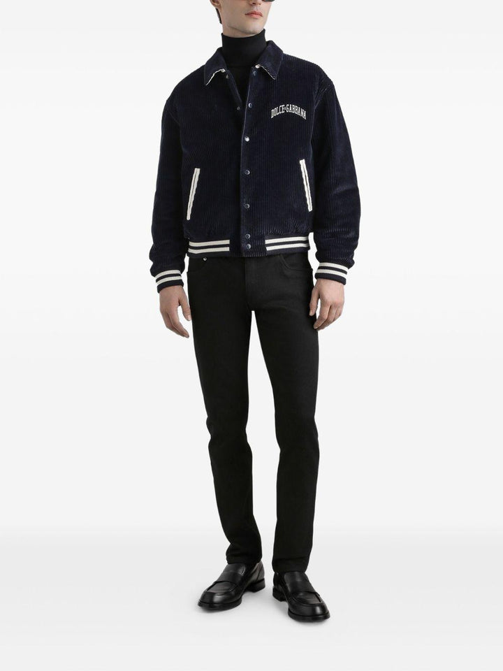 Jeans neri in cotone con placca logo 