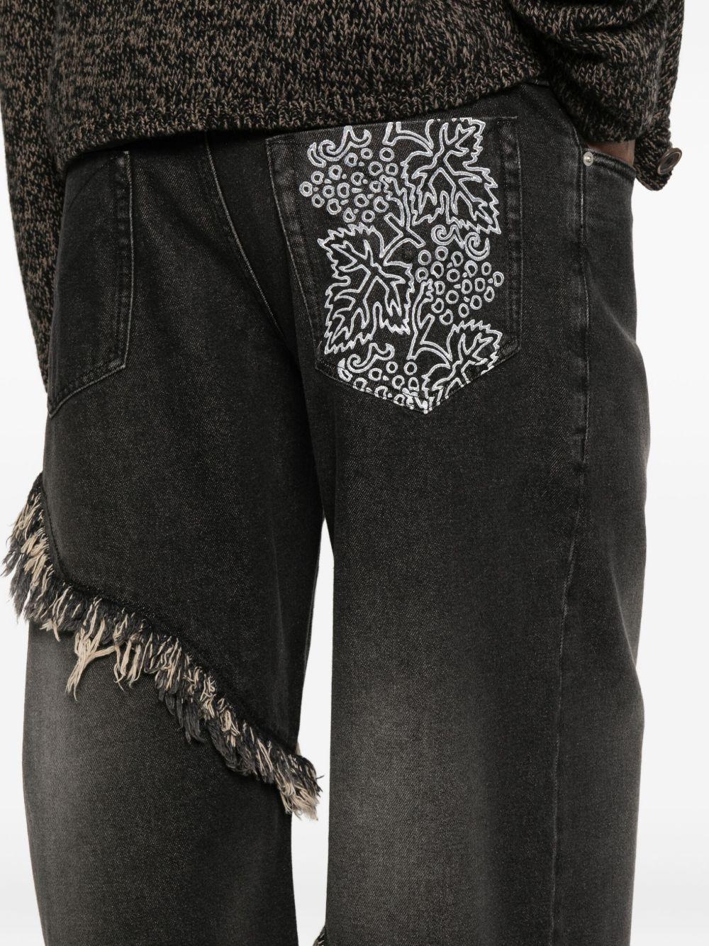 Jeans neri con frange 