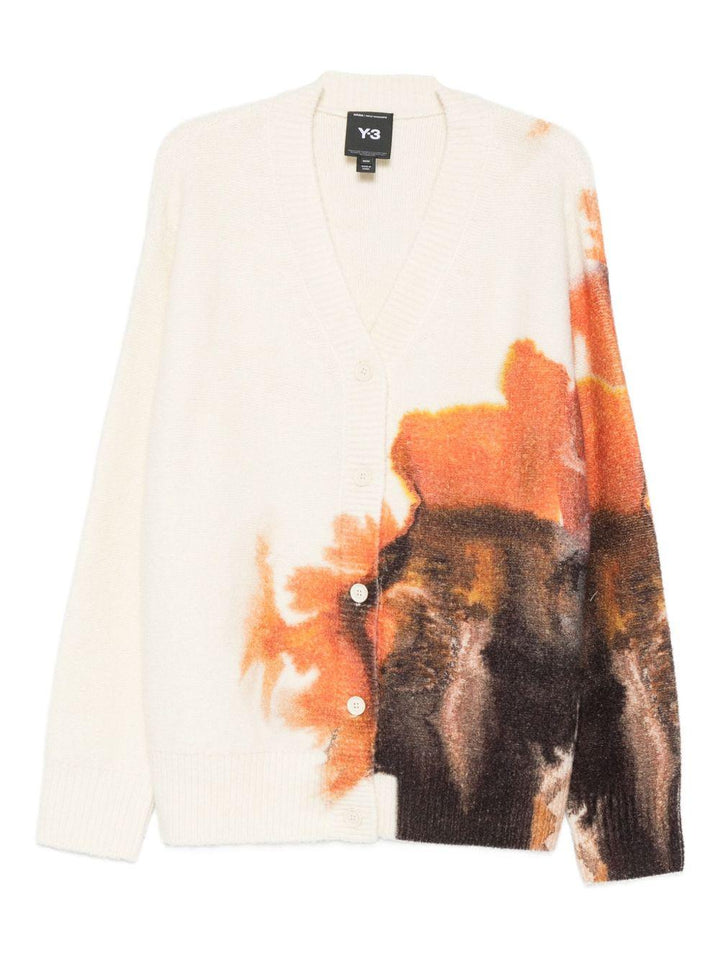 Cardigan bianco con stampa grafica e chiusura a bottoni 