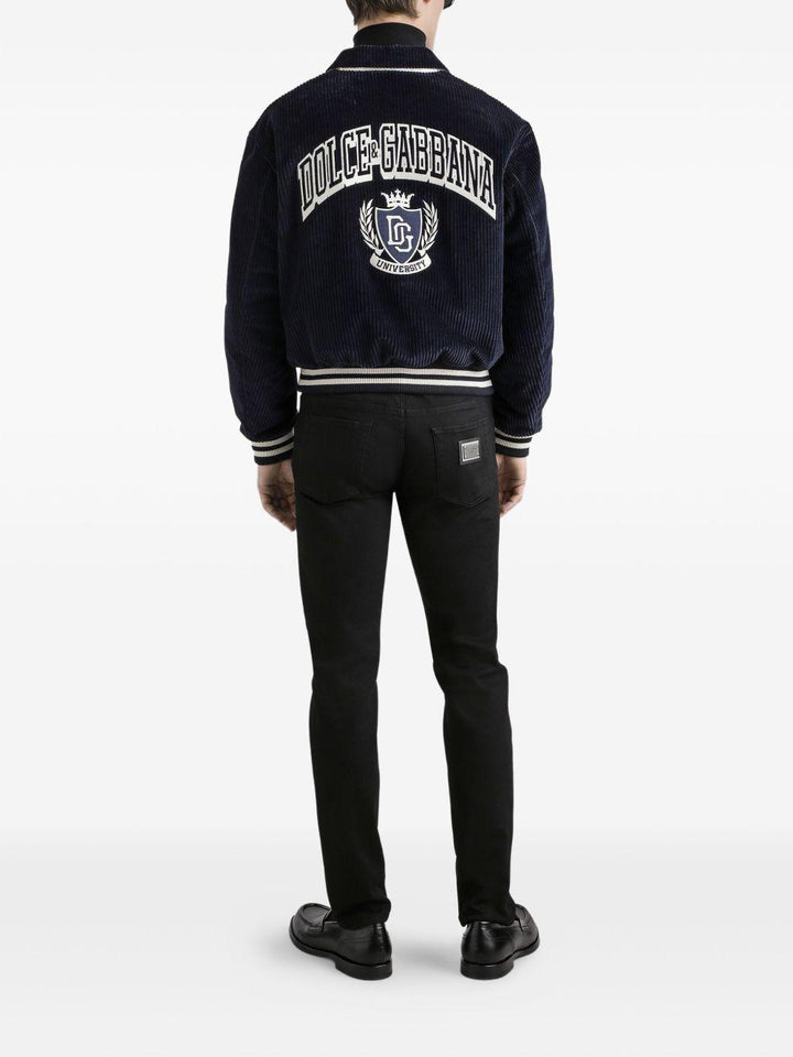 Jeans neri in cotone con placca logo 