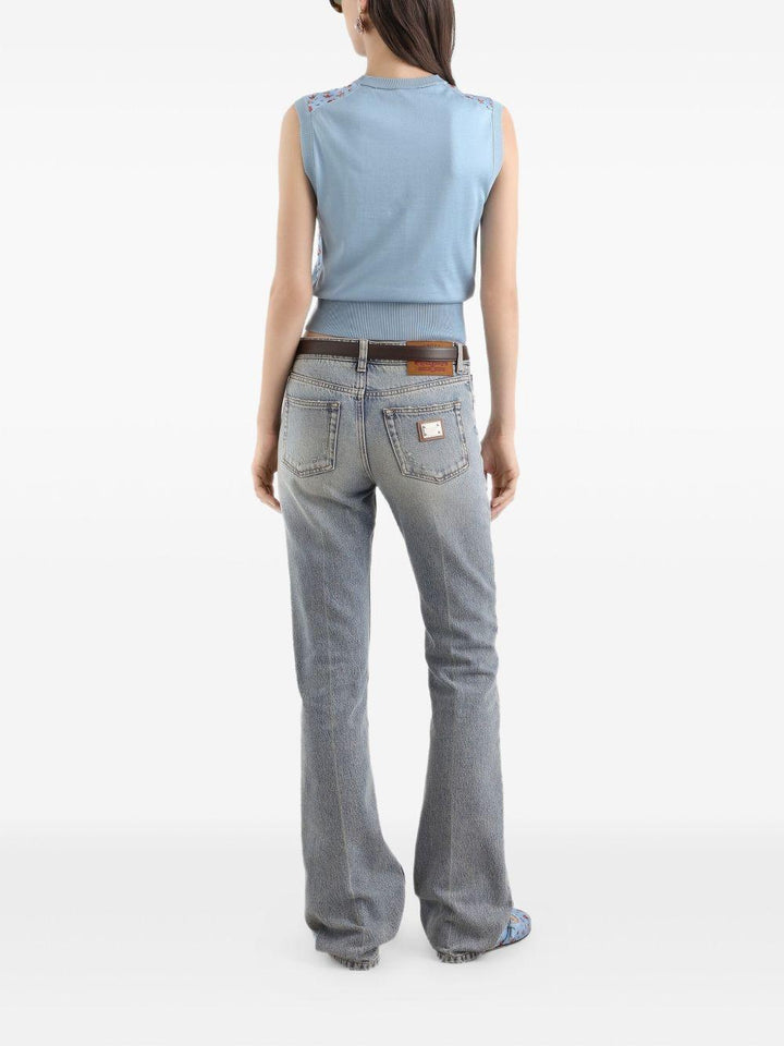 Jeans con placca logo 