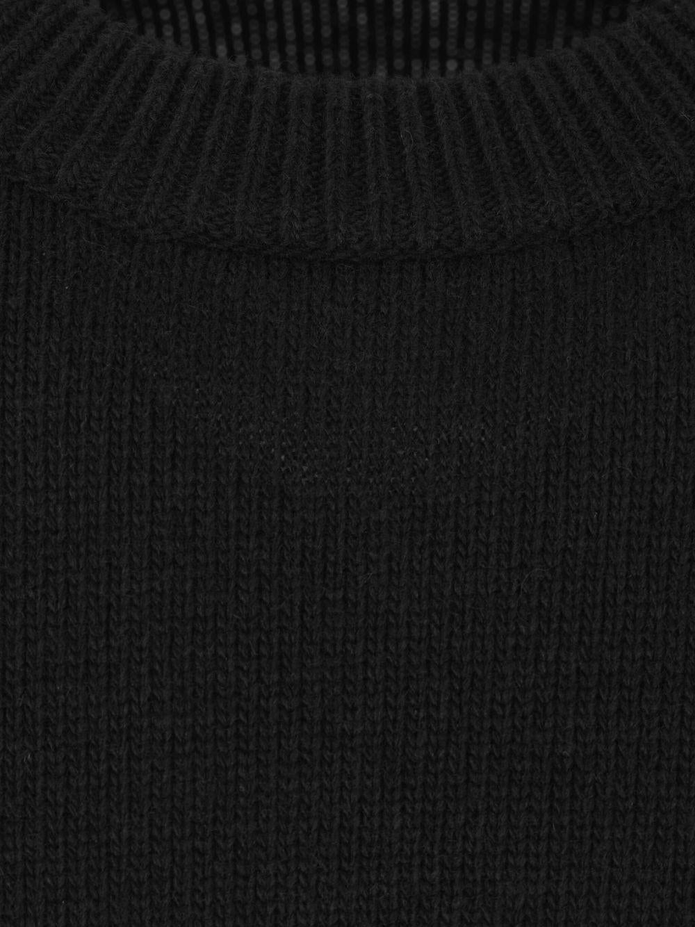 Maglione nero girocollo con applicazione Compass 