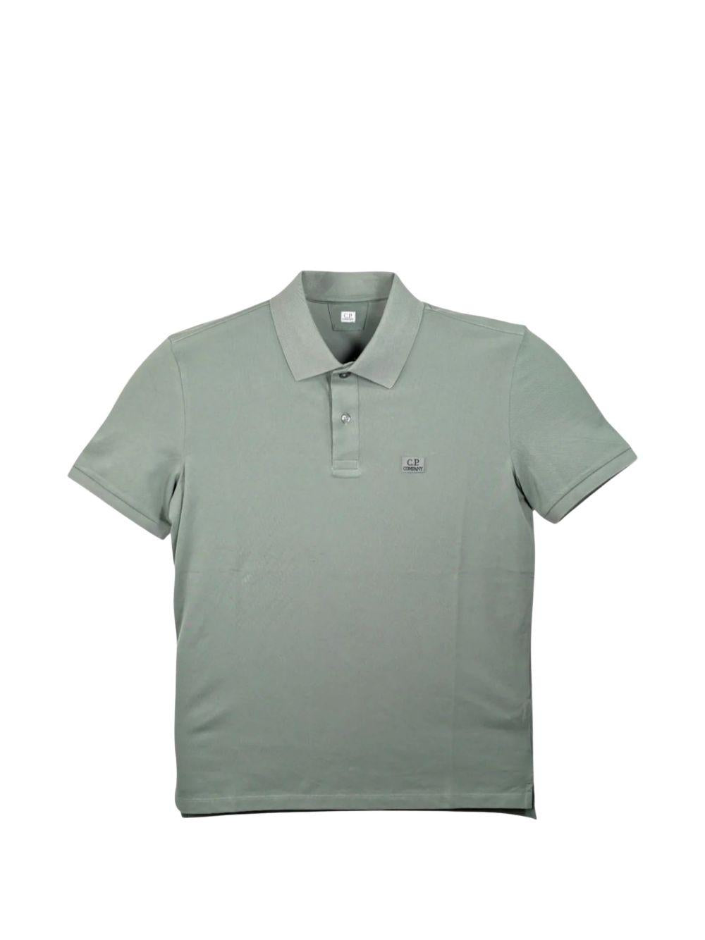 Polo verde con patch logo 