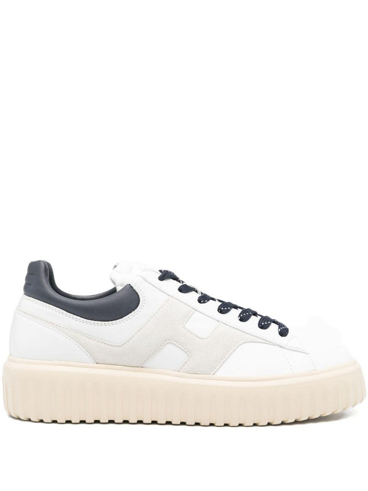Sneakers bianche in pelle con suola rialzata 