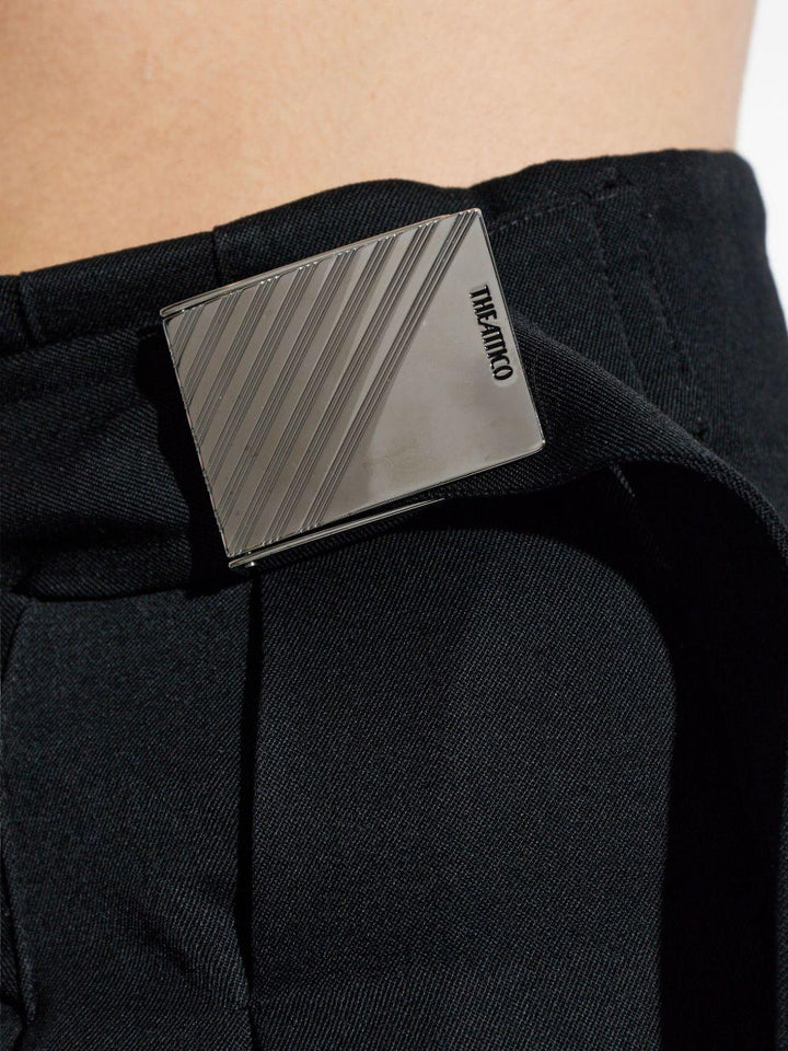 Pantaloni con fibbie 
