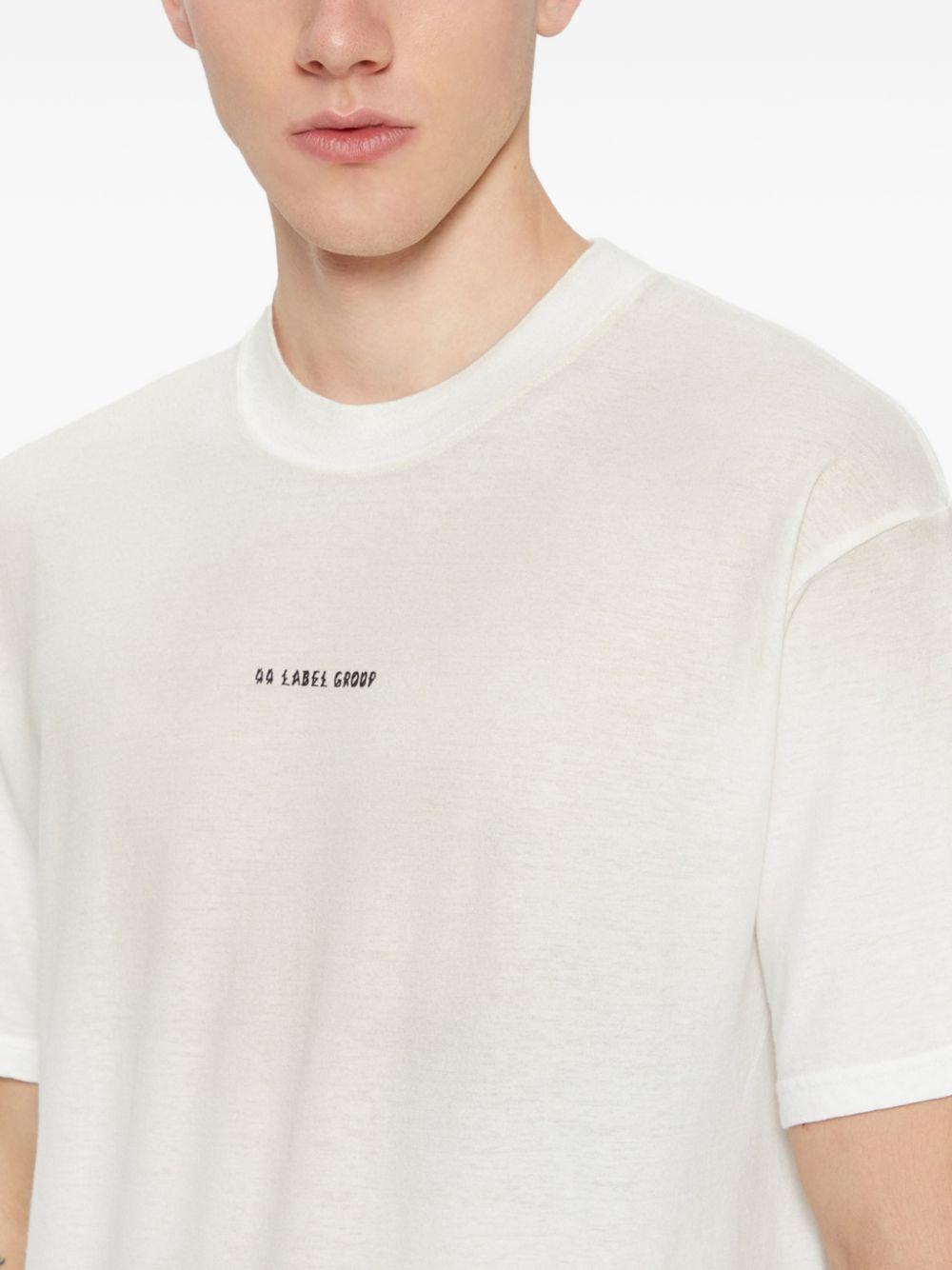 T-shirt bianca e nera in jersey con logo 