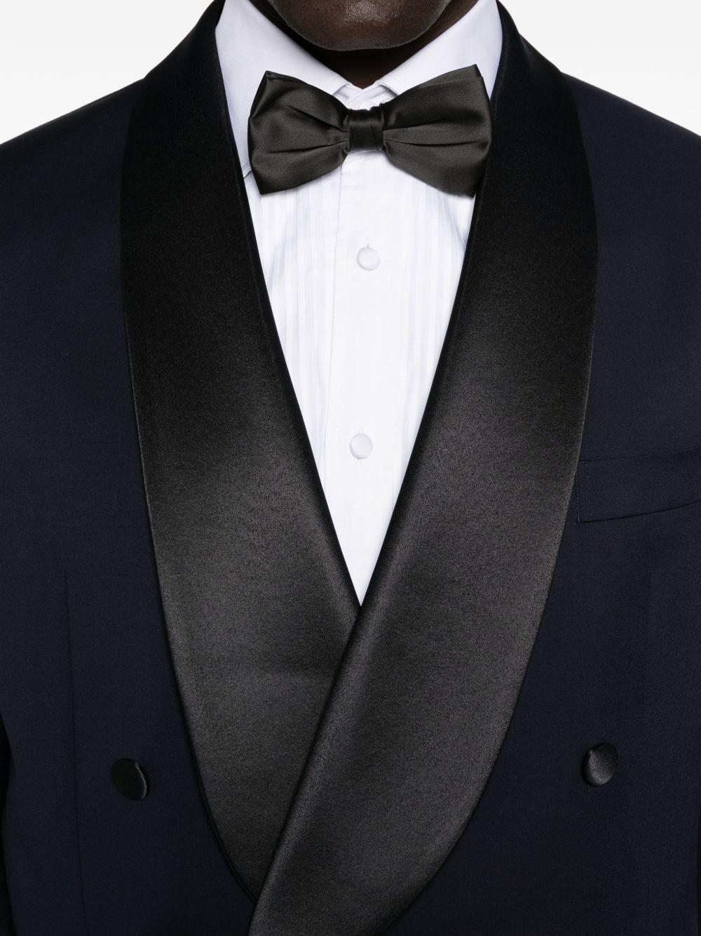 Smoking doppiopetto con profili in satin blu navy 