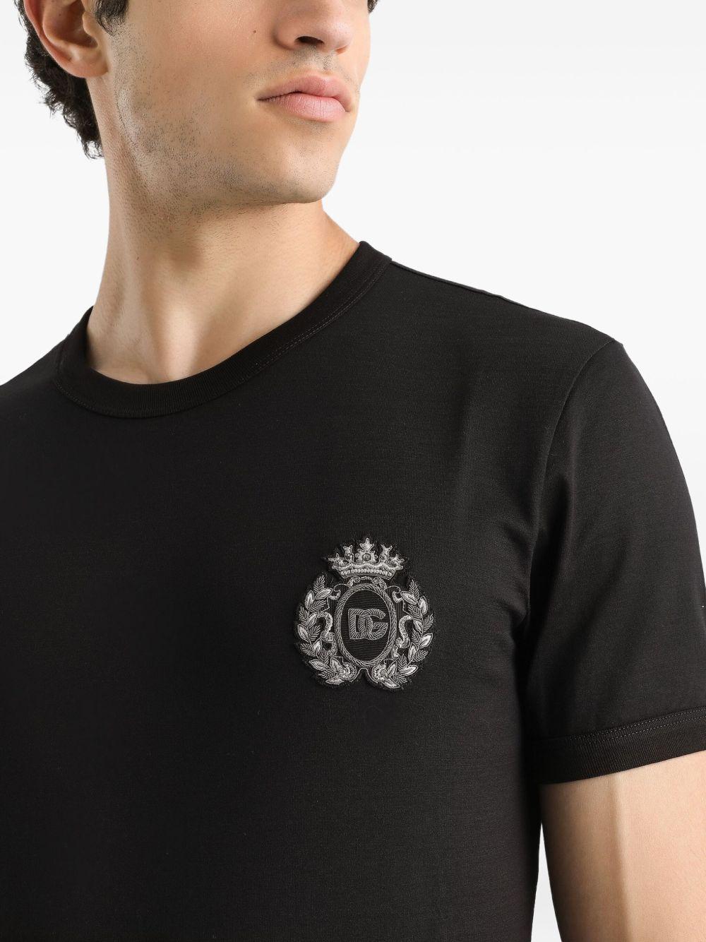 T-shirt nera in cotone con logo ricamato 
