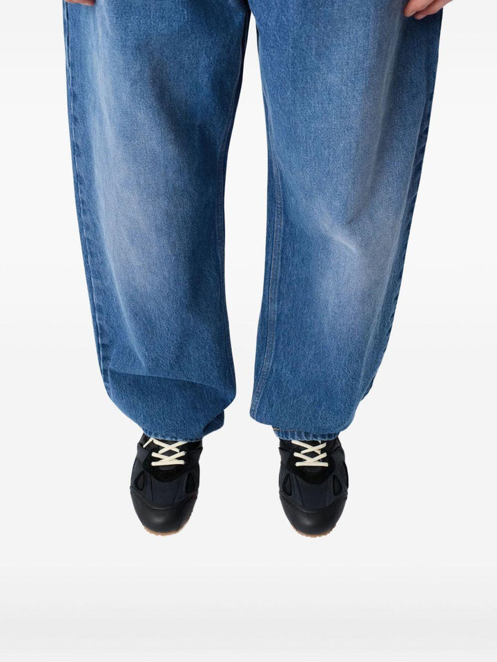 Jeans blu a gamba ampia con effetto vissuto 