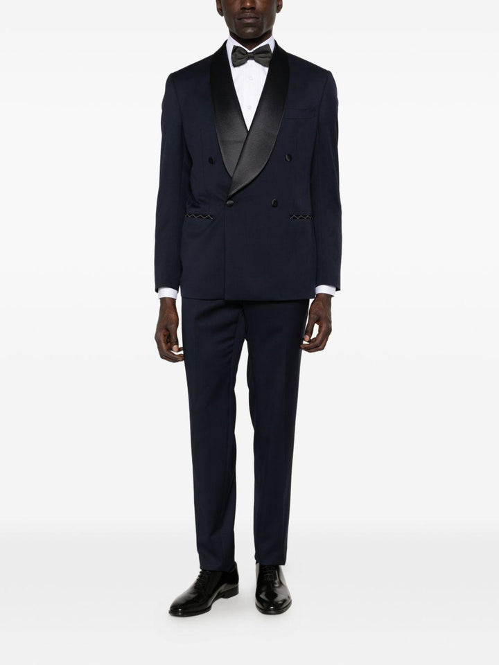 Smoking doppiopetto con profili in satin blu navy 