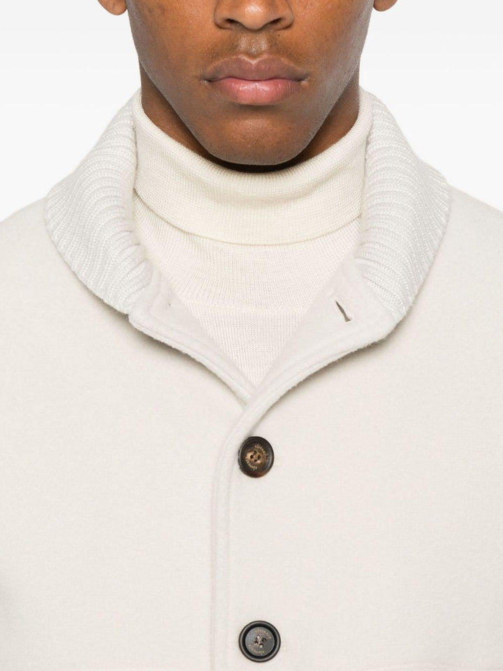 Giacca beige con bottoni e polsini a coste