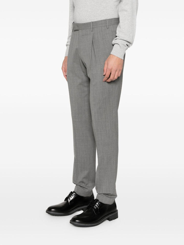 Pantaloni grigi con chiusura nascosta 