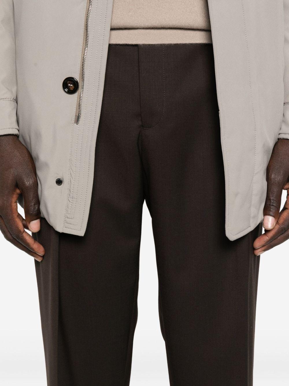 Pantaloni marroni con pieghe frontali Portobello 