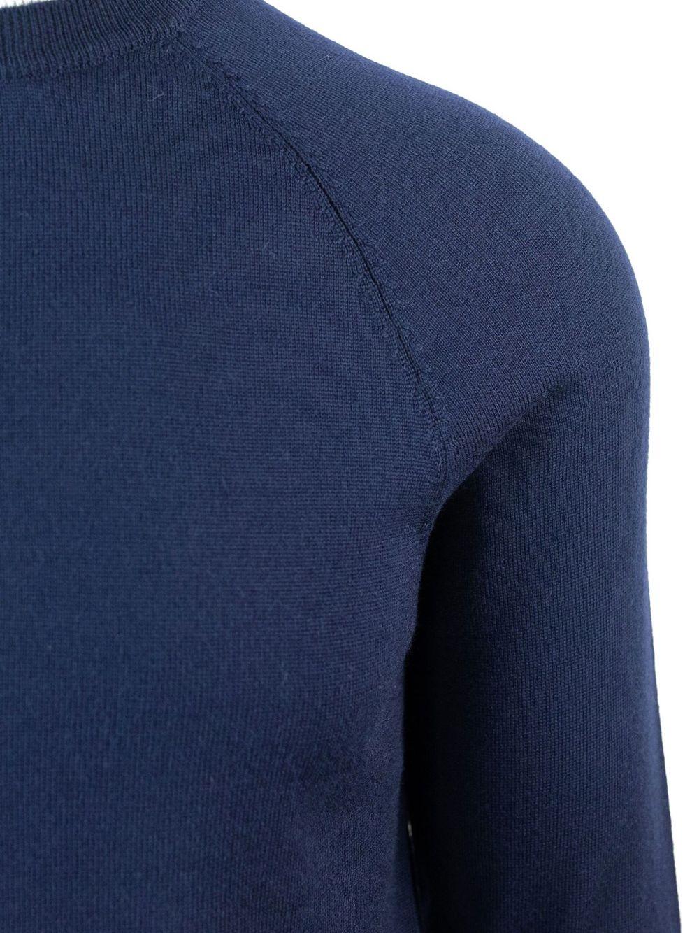 Felpa blu in lana vergine con maniche raglan 