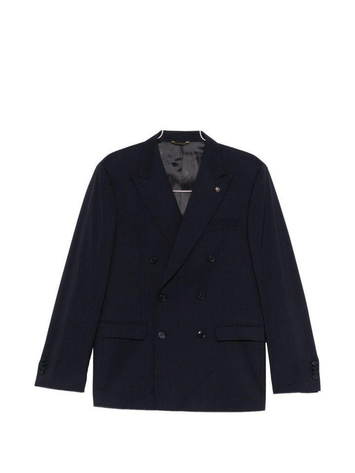Abito blu navy doppiopetto con spilla sul revers 