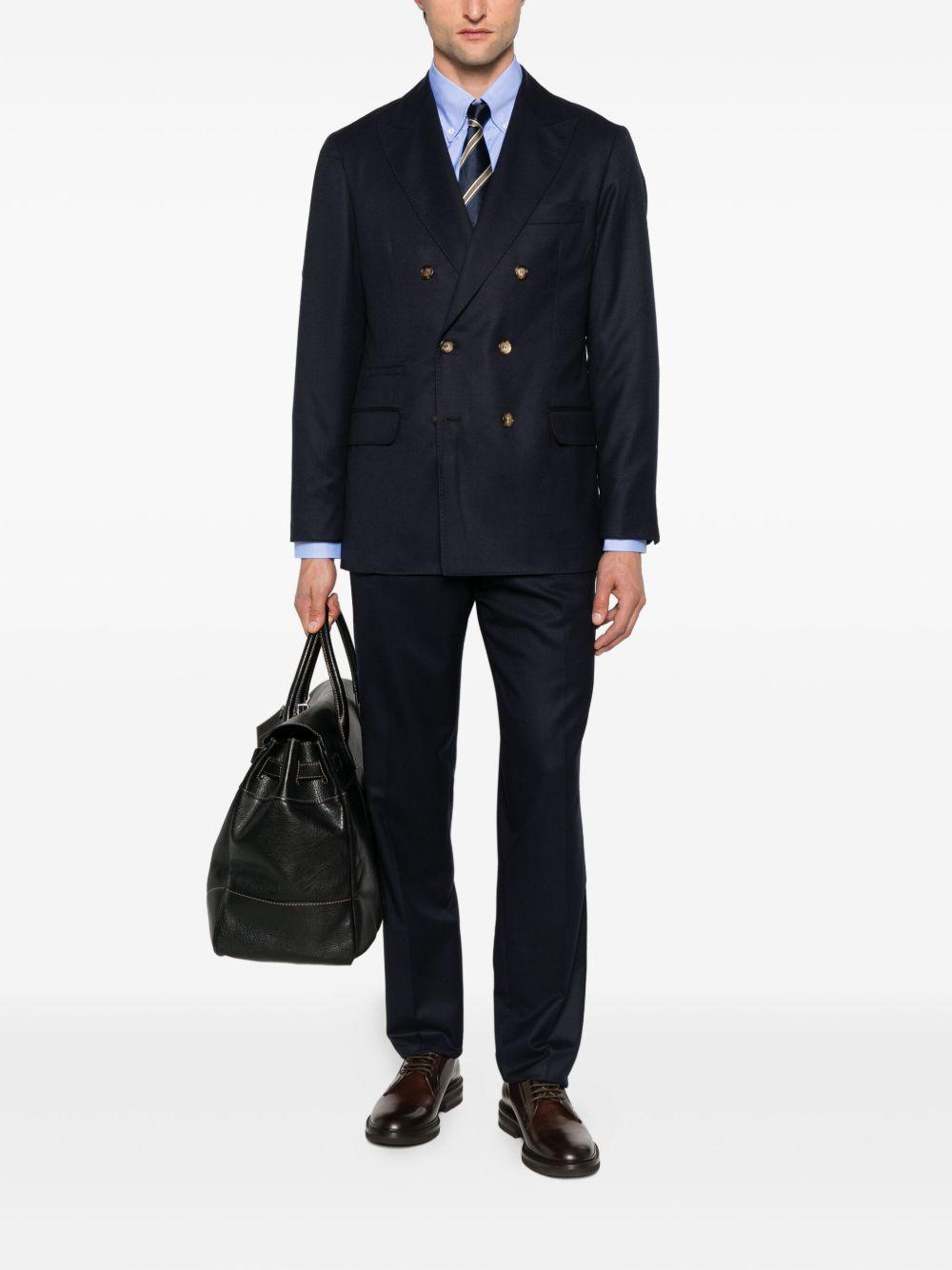 Pantaloni blu scuro in lana plissettati con patta e tasche a filetto 