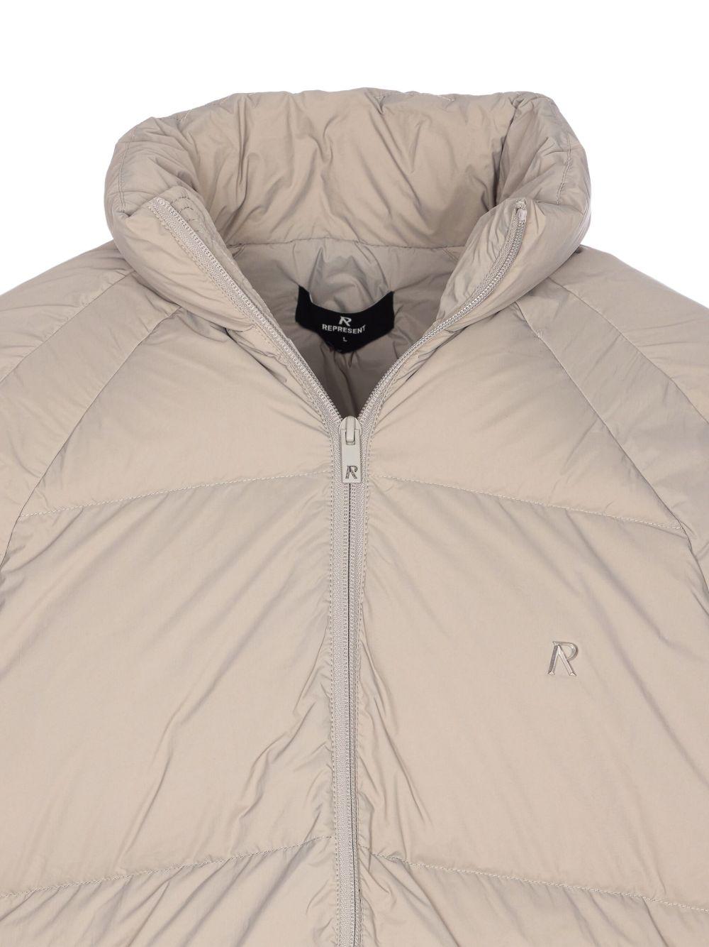 Piumino con collo a imbuto beige 