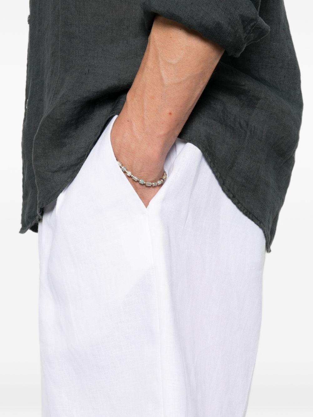 Shorts bianco con pieghe 