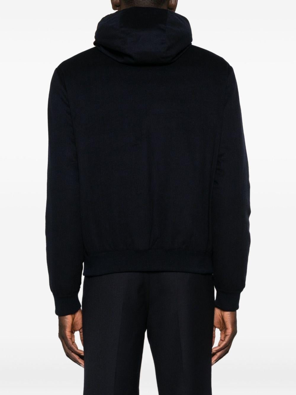 Giubbino  blu con zip e cappuccio 