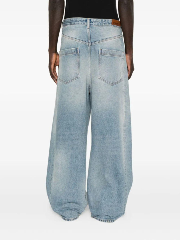 Jeans azzurri con design a incrocio 